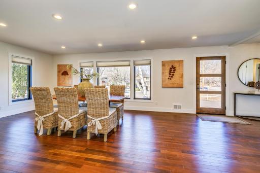 Front portion of main level living spaces. Currently used as a formal dining space - one may choose to continue this trend, open and expand living space or personalize to a desired function space.