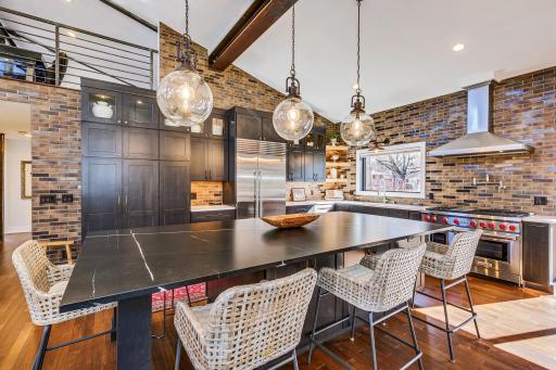 Six burnet Wolf stove complete with griddle, double oven, subzero refrigerator are but a few of the desired appliances featured in this kitchen. In cabinetry and under cabinetry lighting - offers ambiance and functional lighting to complete the menu