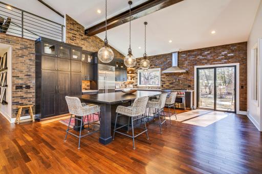 Huge center island will prove to be the 'hub' of this majestic home. A gourmet kitchen that stands above the rest. From counter space to custom cabinetry, to executive appliances - this creation space is dressed to impress.