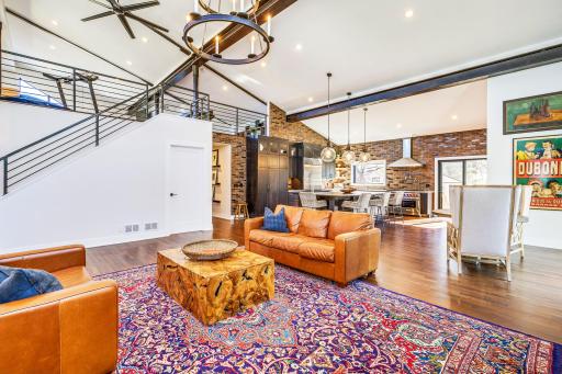 Wide open dream kitchen with numerous amenities, inclusive of inlaid brick walls.