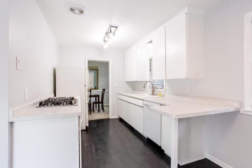 Bright kitchen with generous cabinet storage, updated fixtures, and a clean contemporary look.
