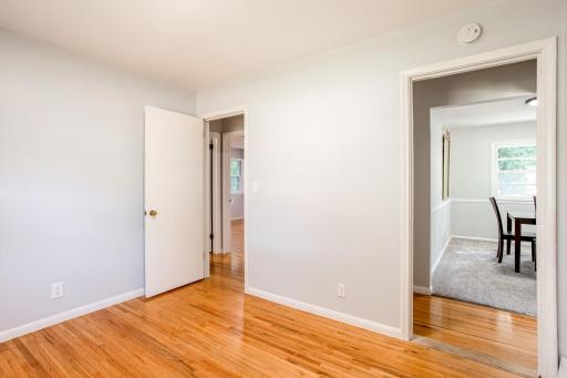Direct access to dining room and hallway, perfect for flexible use as an office or guest room.