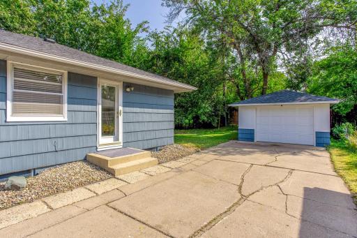 Convenient side entry and extended driveway space offer easy access to the garage and backyard.