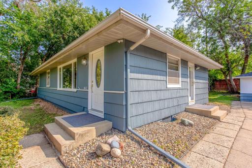Convenient dual entry floor plan surrounded by low-maintenance rock beds.