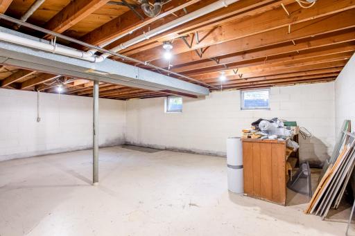Expansive unfinished space with multiple daylight windows and room to build out or customize.