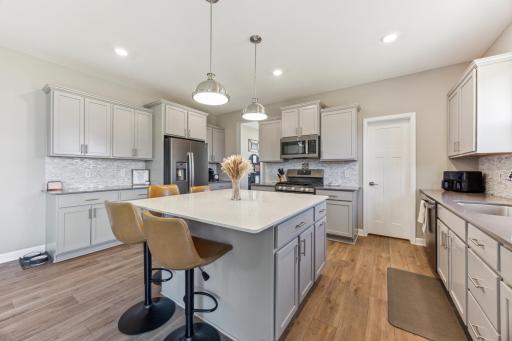 Kitchen features a walk-in pantry, and LOOK at all those cabinets!