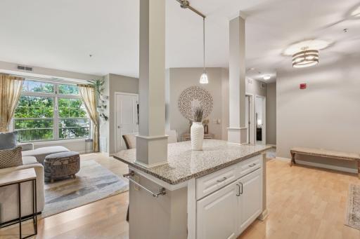 Love this view from the kitchen - huge windows, high ceilings, and open space! Whether you are hosting or just catching up on your favorite show, you're still part of the action!