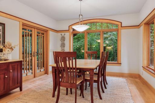 Formal dining room placed off both the living room & the screened in porch, perfect for indoor/outdoor hosting.