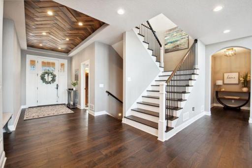 Large front entry will welcome you into this beautiful home with an inlaid wood ceiling and stunning views of the lake!