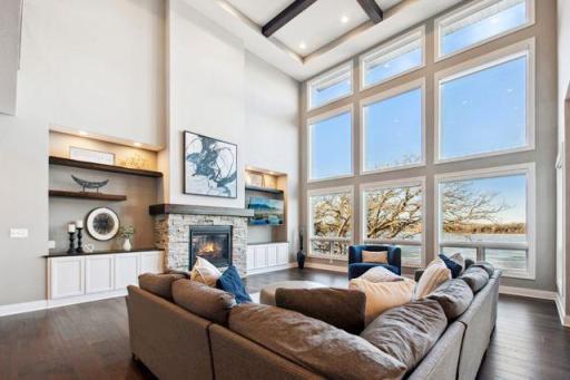 Cozy up and watch the sunset through your floor to ceiling windows equipped with electronic window coverings!