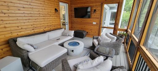 Enjoy your morning coffee while watching TV in this magnificent 3 season porch with amazing views of the lake!