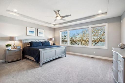 Wake up in this stunning Master Suite to amazing views of the lake!