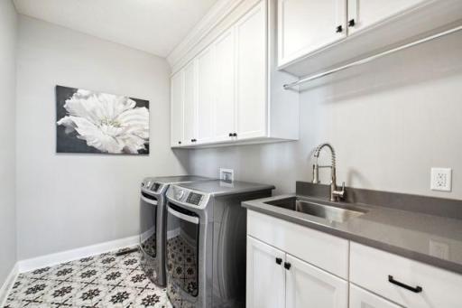 Main floor laundry room with high end appliances