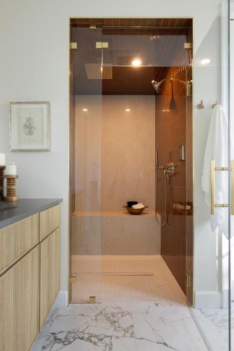 Walk in steam shower with heated bench and flooring