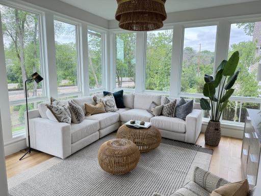 Surrounded by windows, cozy up with coffee or a cocktail
