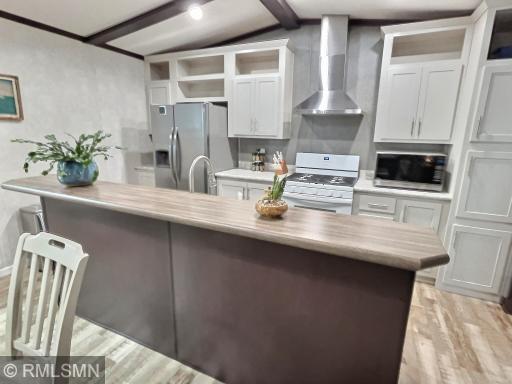 This Kitchen feature a center island with great storage space and modern appliances.