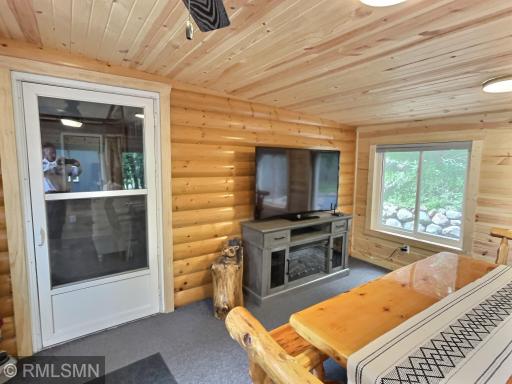 The four season porch currently has a table and tv for extra are to dine.