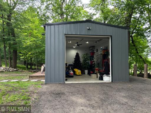 This insulated and concreted was recently added and provides ample room for parking and storage. It also provides an over size door and window to allow natural light.
