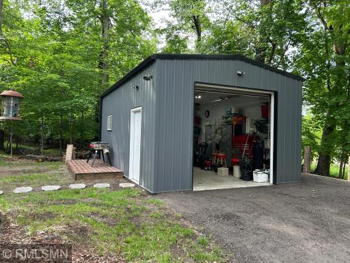 The deck outside of garage and next to firepit makes a great spot for entertaining.
