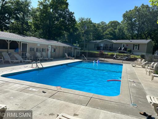 Beautiful community pool next to gathering space for your summer entertaining.
