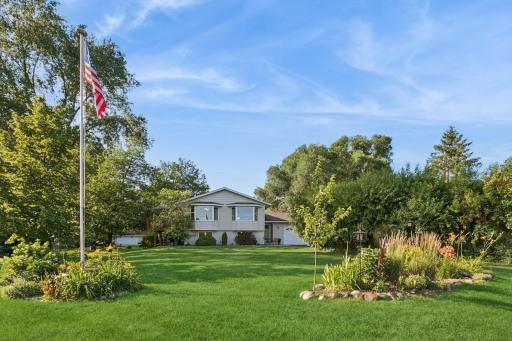 Beautiful street view of the home. Lovely landscaping and curb appeal.