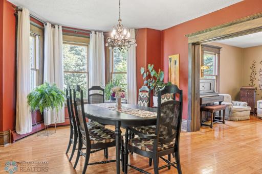 Formal dining with bay windows and pocket doors to formal sitting (one of 3 family spaces).