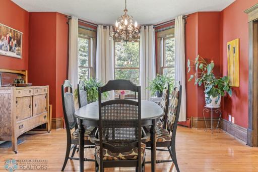 Formal dining with bay windows and pocket doors to formal sitting (one of 3 family spaces).