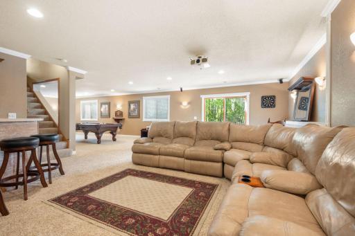 Large family room in lower level that walks out to patio