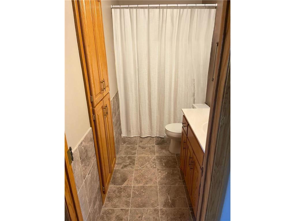 Full bathroom on upper level with new marble flooring