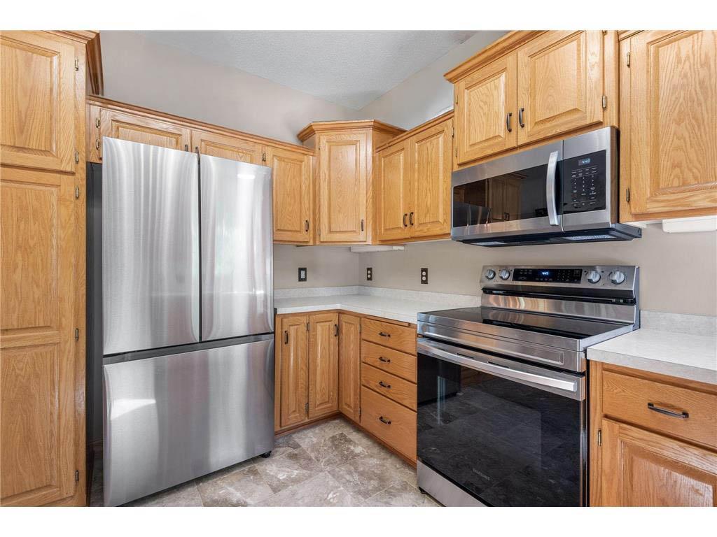 Updated SS appliances and beautiful custom oak cabinets