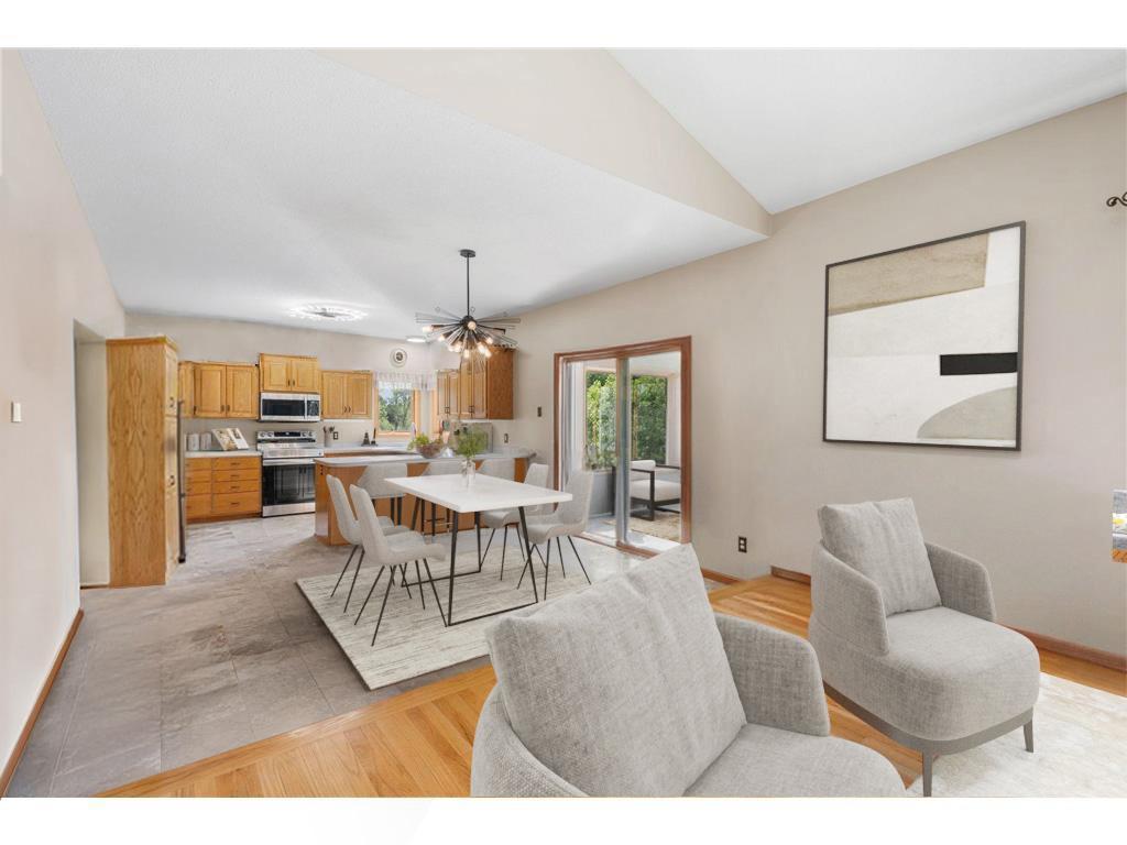 Dining Area with marble floors that walks out to porch- virtually staged