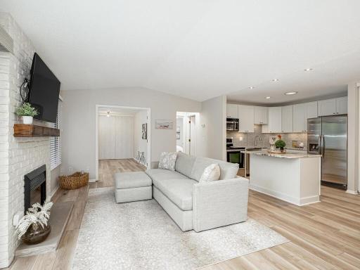 Welcome home to 1181 Yuma Ln N. Bright and airy great room featuring vaulted ceilings, a cozy fireplace, and new LVP flooring. Fully renovated in 2022, this space offers modern comfort and style.