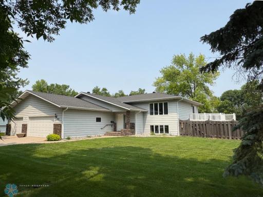 Steel sided home, huge 36 x 30 triple garage, and fenced yard!