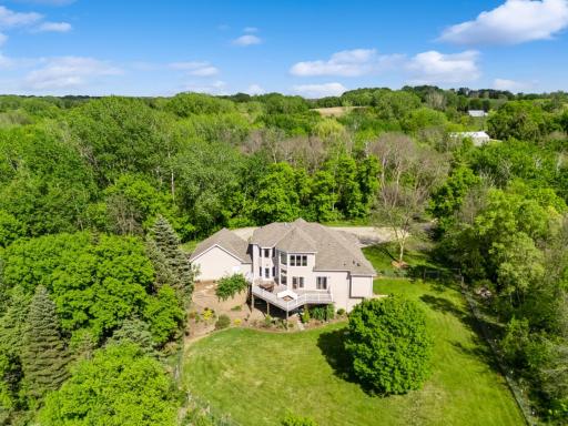 Peaceful setting on 6.5 acres with sweeping views of wildlife filled wetlands and wooded privacy.