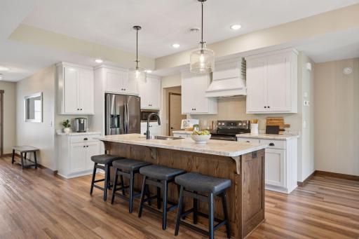 The large center island with breakfast bar seating is a showpiece of this thoughtfully designed kitchen.