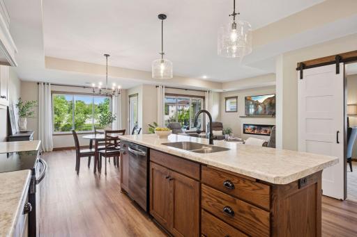 The kitchen is open to the living and dining rooms, making it perfect for casual meals or hosting gatherings.