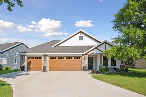 Welcome to this charming one-story home with classic architecture. The warm wood-tone garage doors create a welcoming first impression from every angle. The garage is insulated and heated with a mechanical closet and pull-down attic storage.