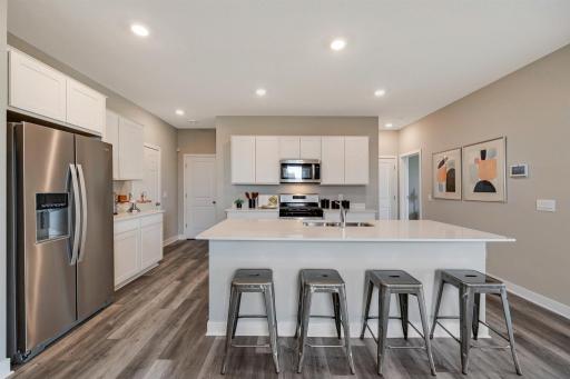 On trend white cabinets and Quartz counters.