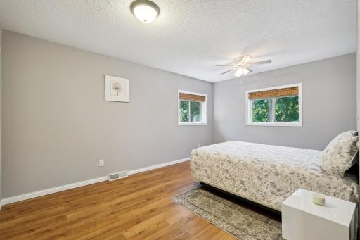 Another equally positioned third bedroom featuring ample natural sunlight