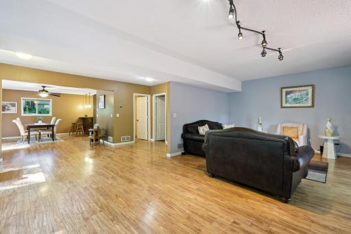An open concept throughout the entire living area throough the dining room and kitchen