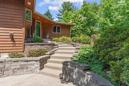 Curb appeal shines with a landscaped entryway.