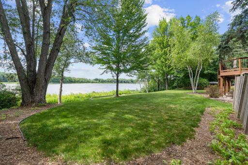 Private backyard retreat surrounded by mature trees.