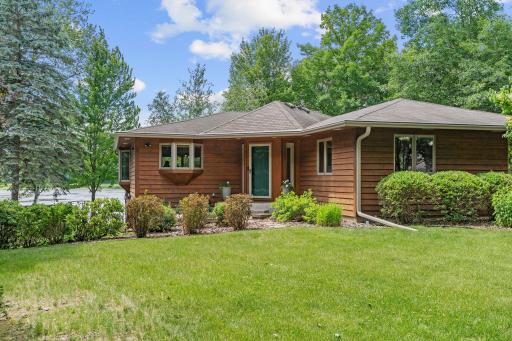Mature landscaping surrounds the property.