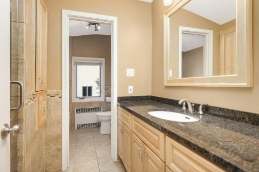 Upper level bathroom with large soaking tub and seperate walk in shower.