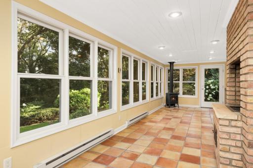 Gracious sunroom stretches across the back of the home at 9x35.