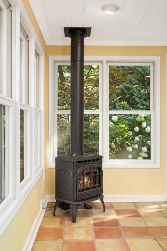 Newer windows and fireplace keep this space cozy while your feet are soothed by the feel of hand made tiles.