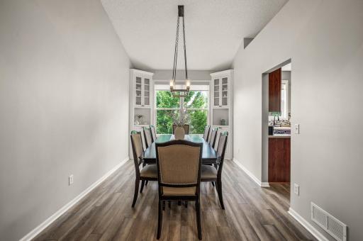 Dining room boasts custom built-in cabinets