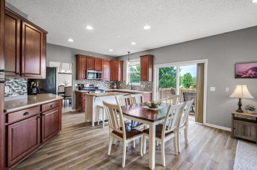 Informal dining area has a patio door to the deck