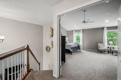 French doors open to the vaulted primary suite
