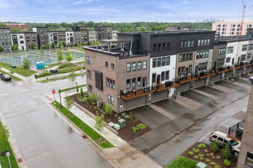 Great end unit with roof top terrace plus balcony off main level and 2 car garage!
